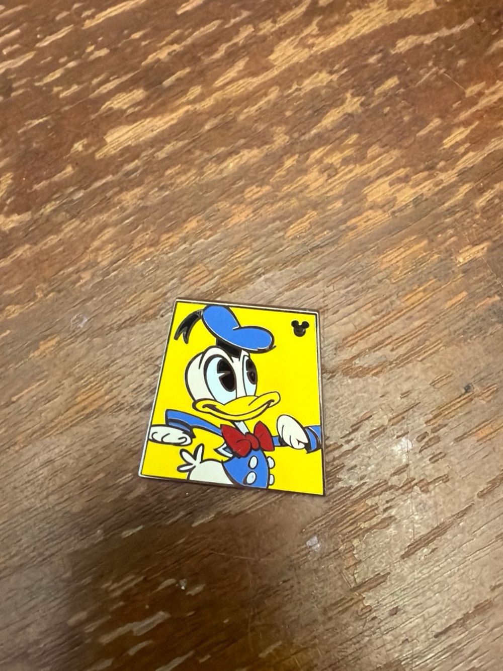 Disney Donald Duck Pin — Bright Yellow Background with Blue Hat and Red Bow